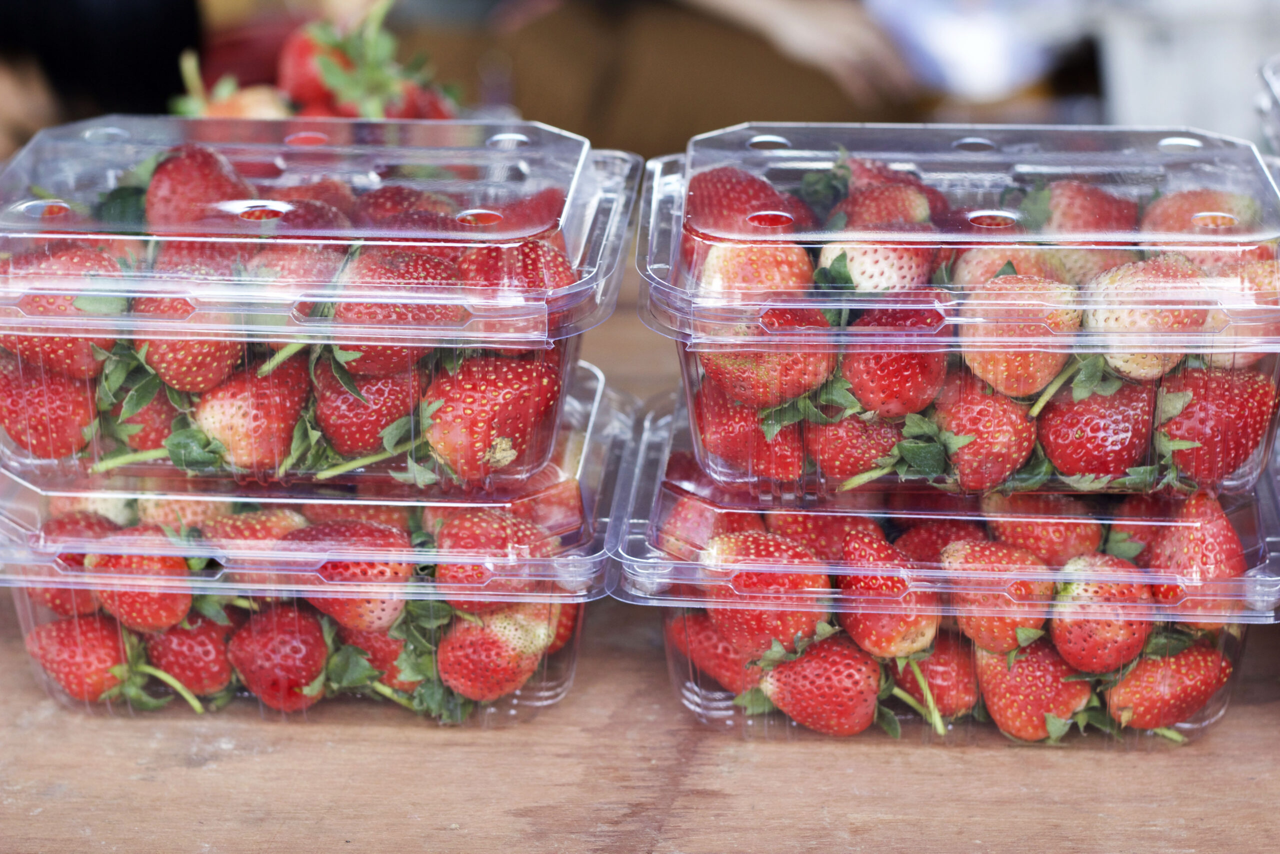 Four boxes of strawberries in PET thermoforms.