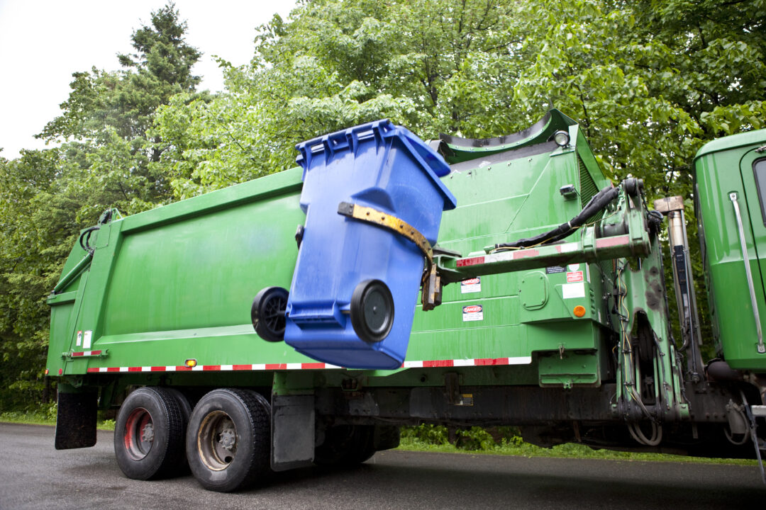 Robot Arm empties Wheeled Recycling Bin.