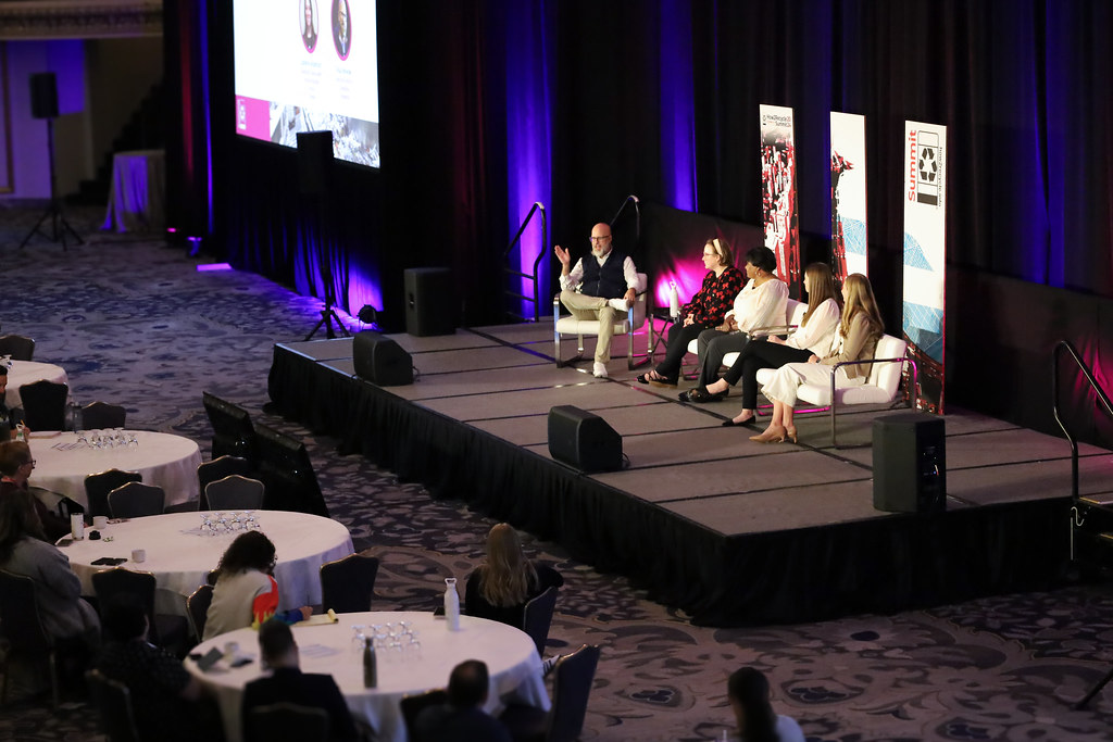 Emily Williams, new How2Recycle Director, sits on stage at the How2Recycle Summit with GreenBlue Executive Director Paul Nowak.